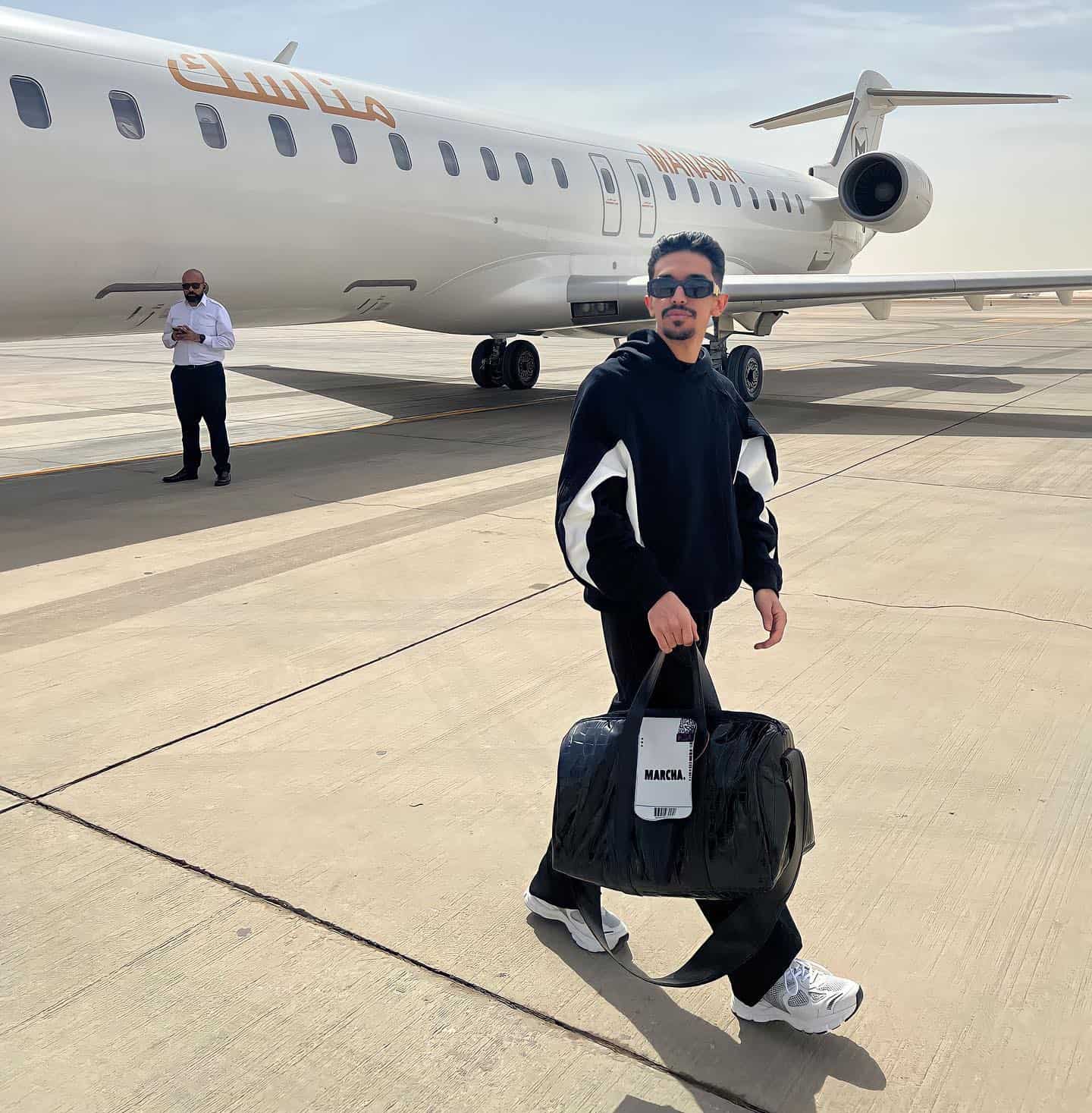man walking away from a plane