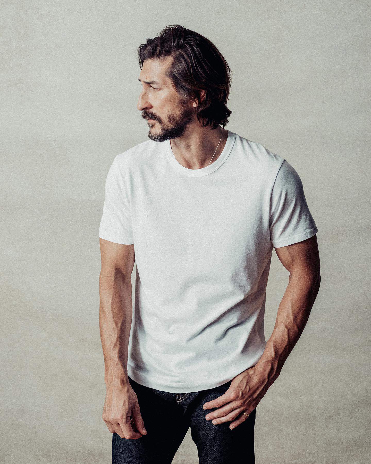 man wearing a white buck mason tee