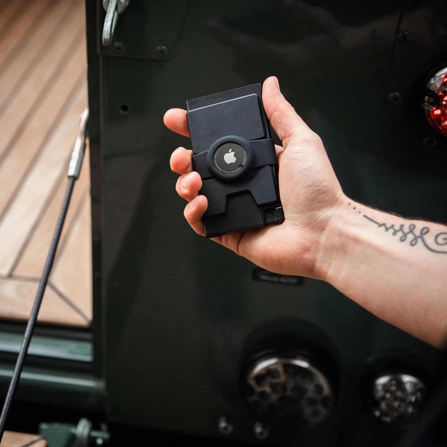 holding a trackable wallet