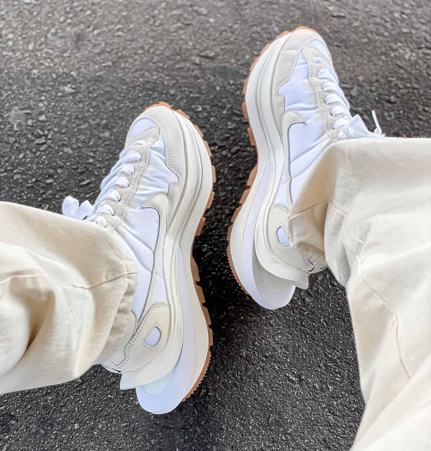 wearing a pair of white nike vaporwaffle