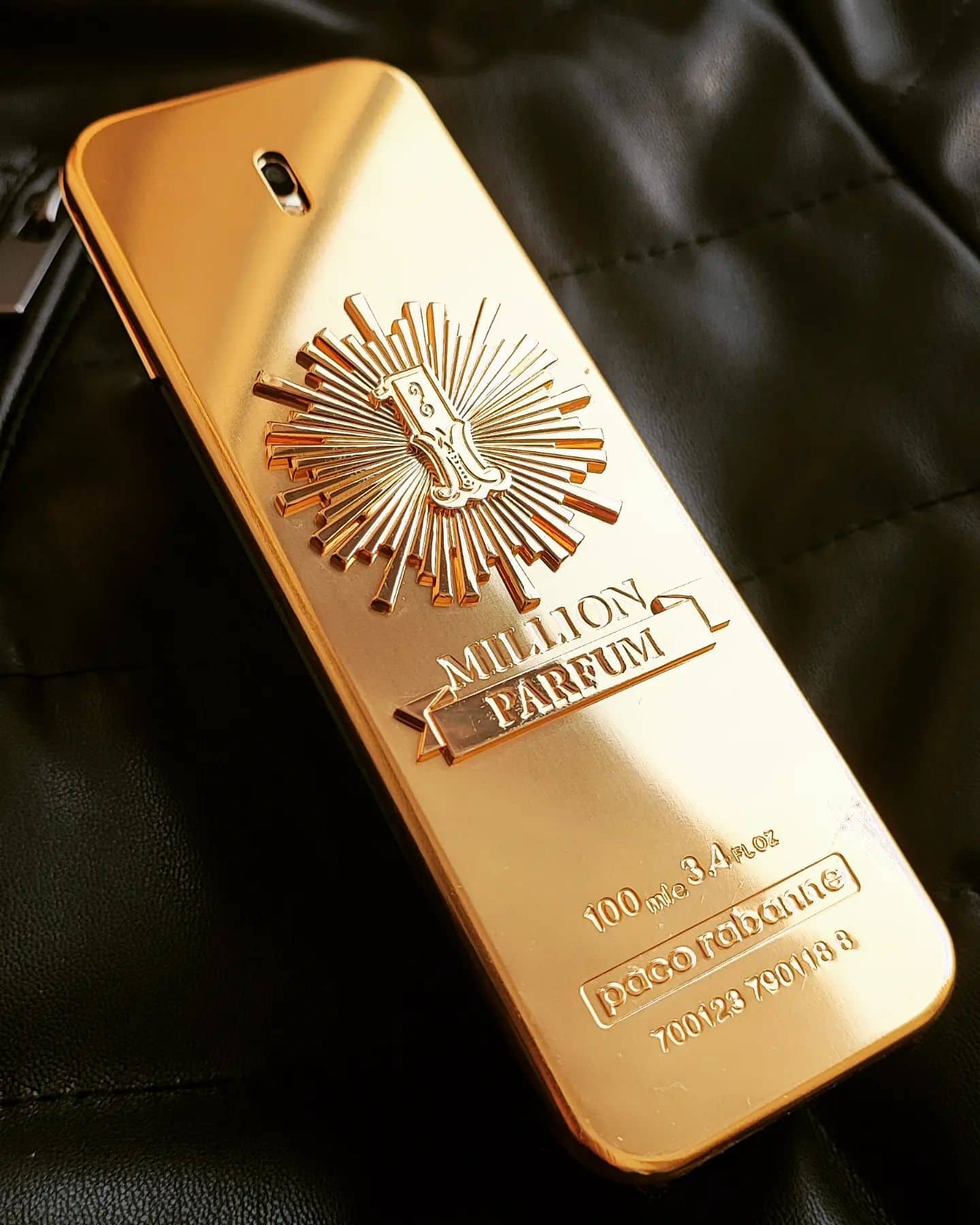 Paco rabanne 1 million on top of a leather jacket