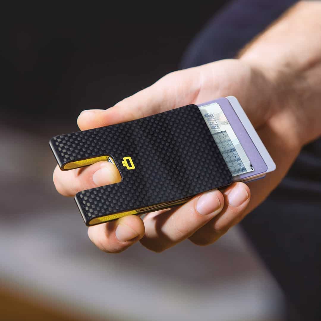 Sliding out cards from carbon a fiber wallet
