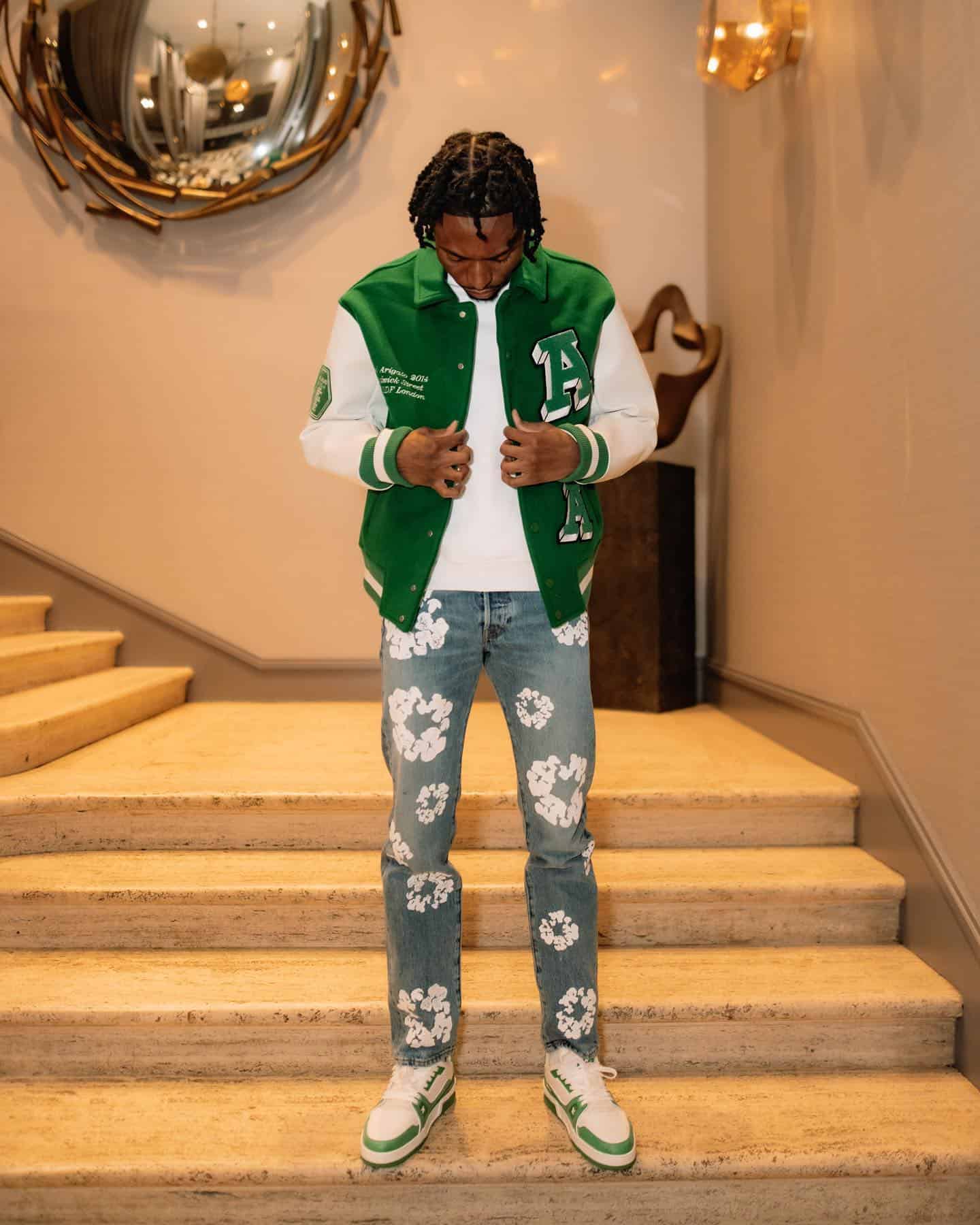 matching a varsity jacket with a pair of Dice Lo sneakers