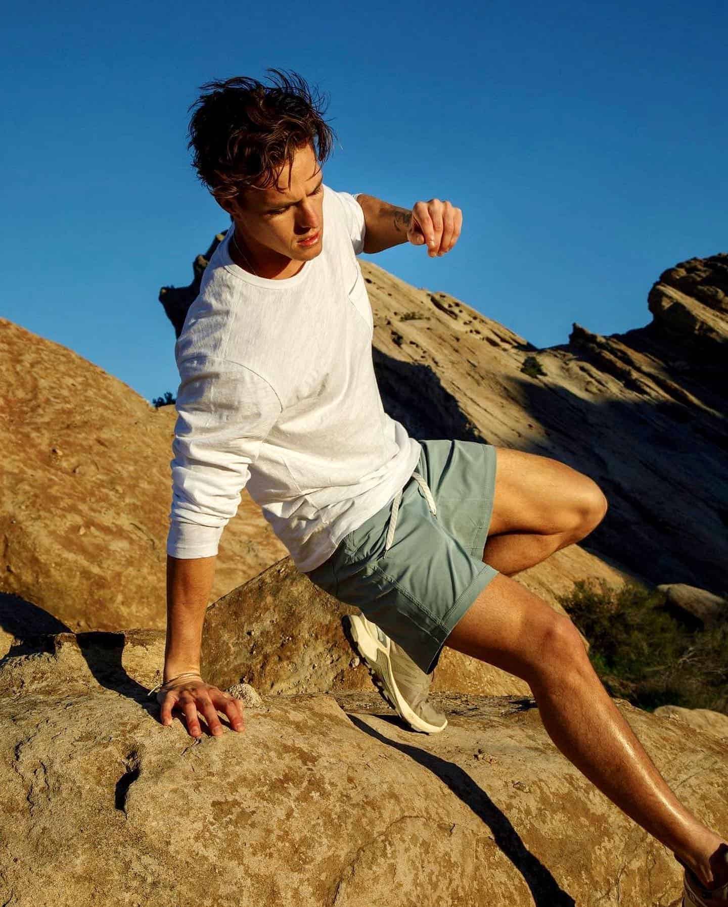 man jumping down the rocks