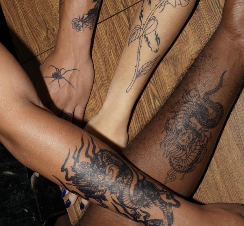arms with temporary tattoos