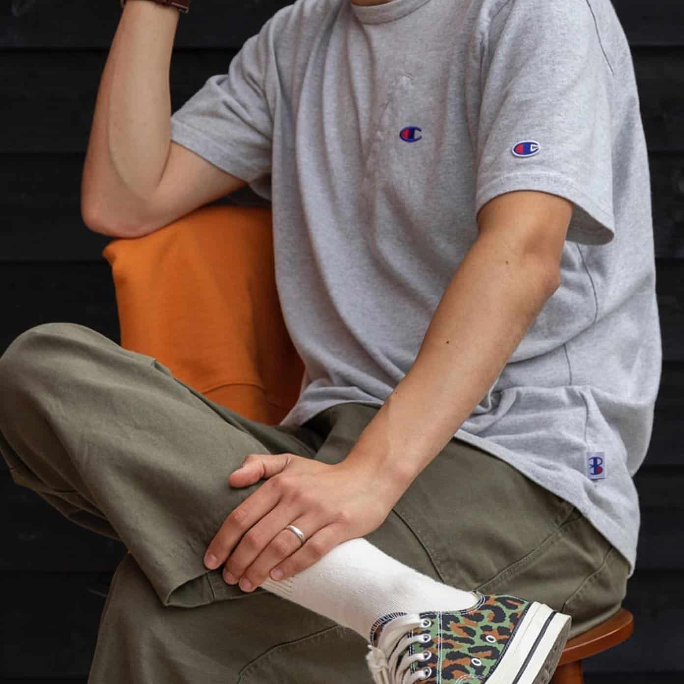 man sitting on a chair cross legged