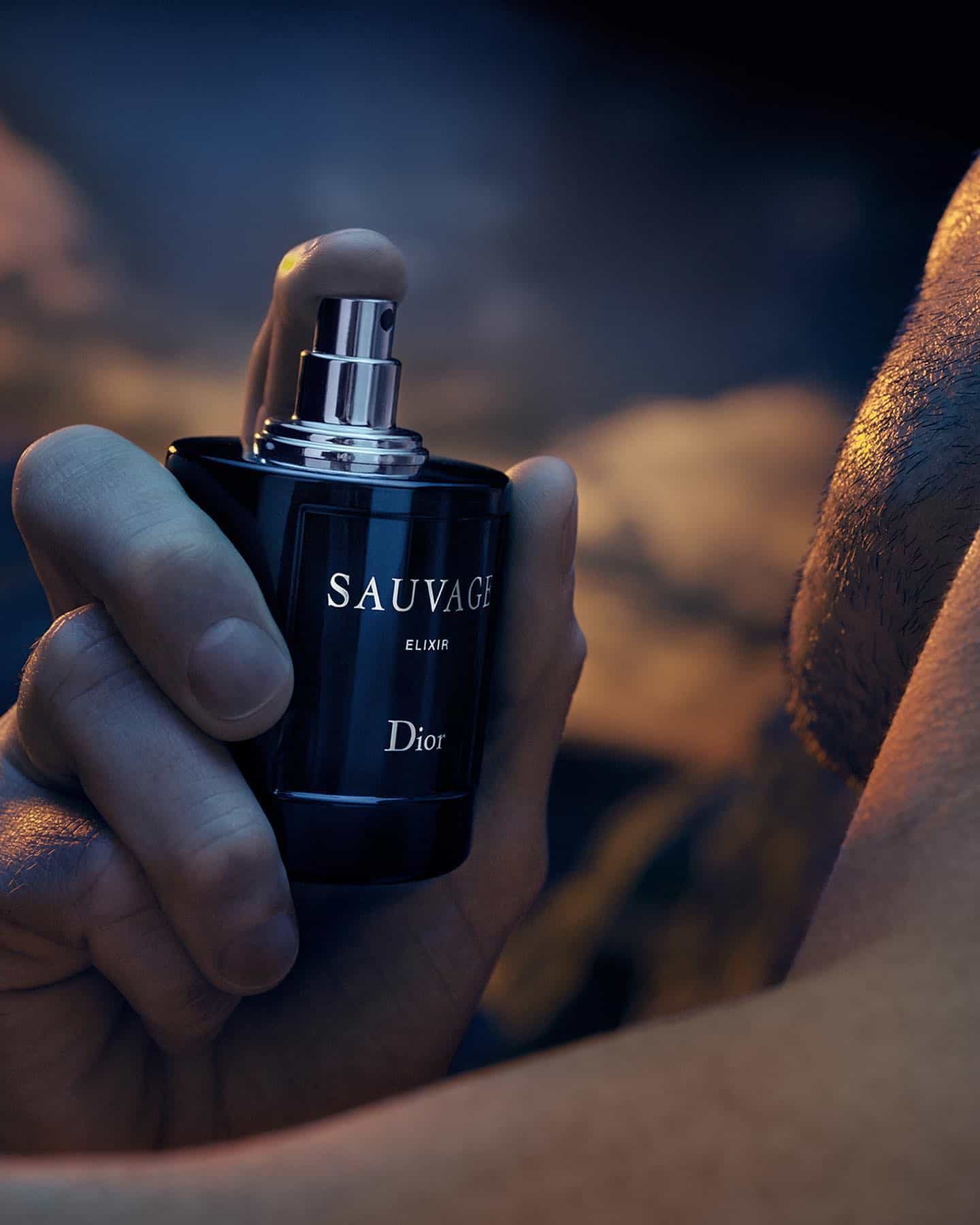 applying a dior sauvage on the neck