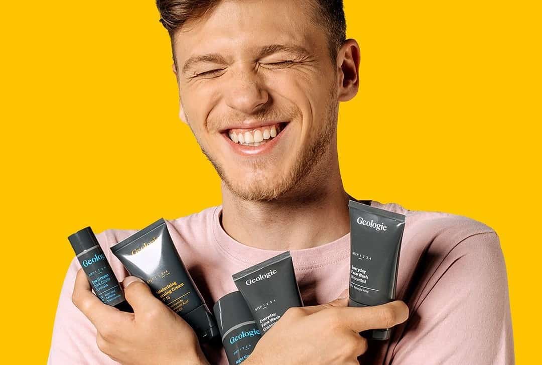 man hugging geologie skin care products