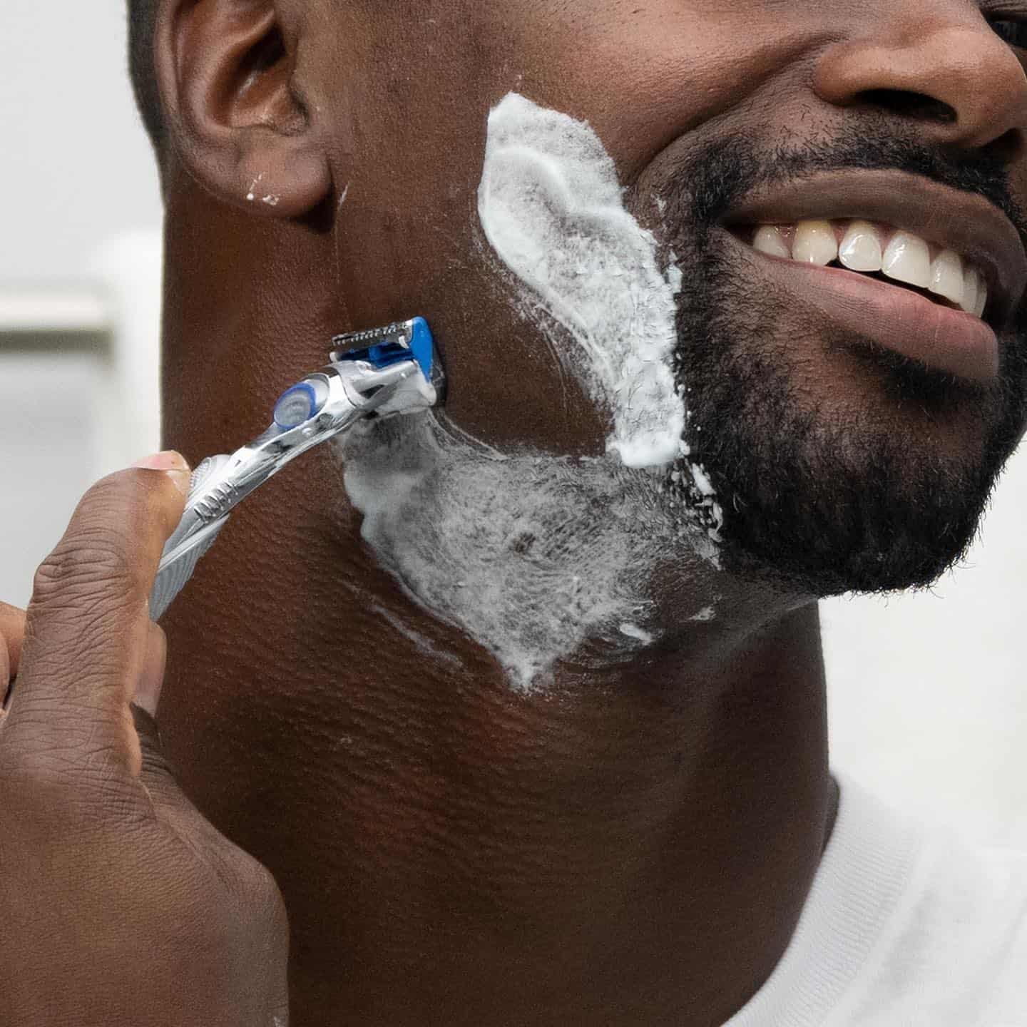 a man shaving his beard