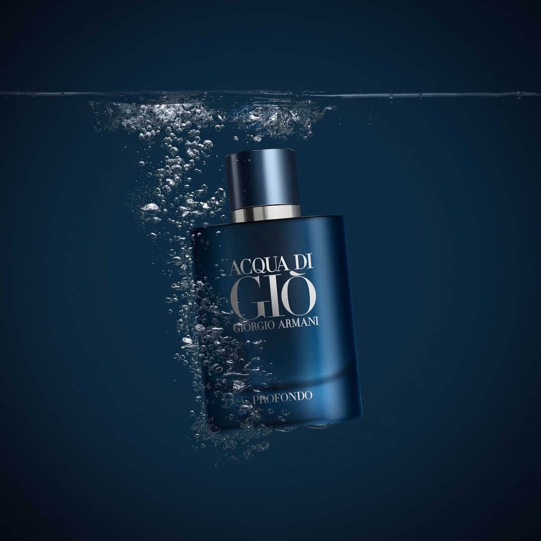 a bottle of acqua di gio profondo sinking into the water