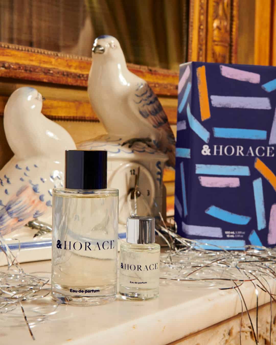 two bottles of horace eau de parfum on a mirror stand