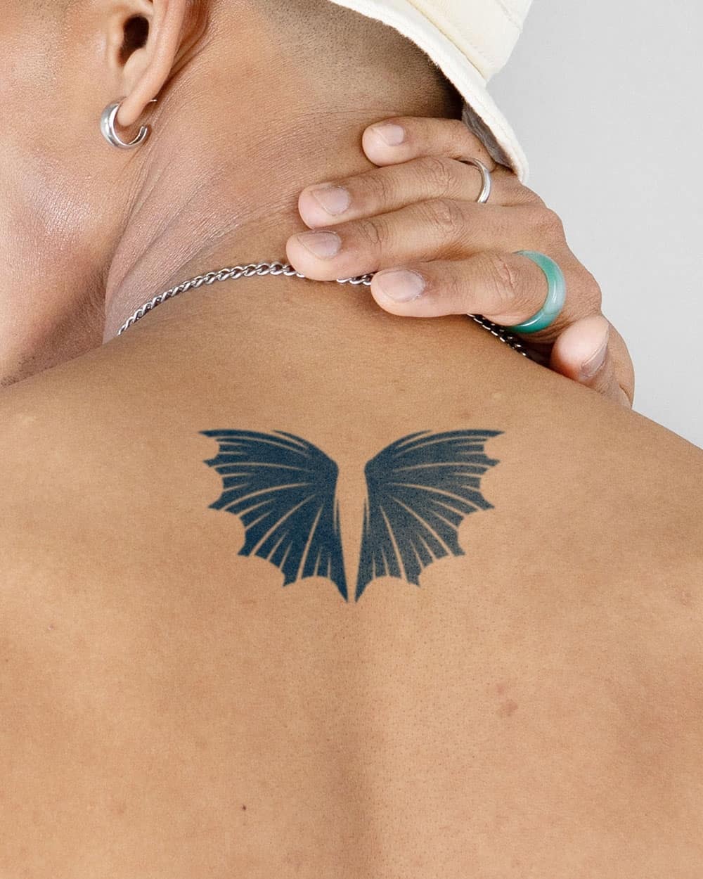 small temporary dragon wings tattoo on the back