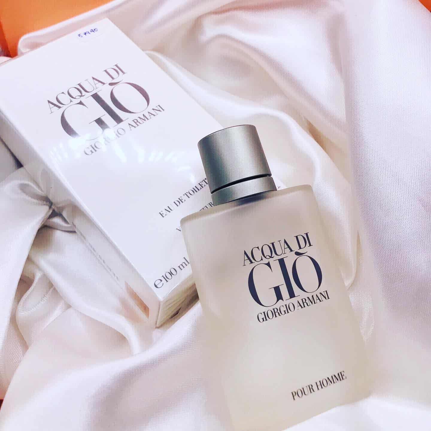 a bottle of acqua di gio and its box