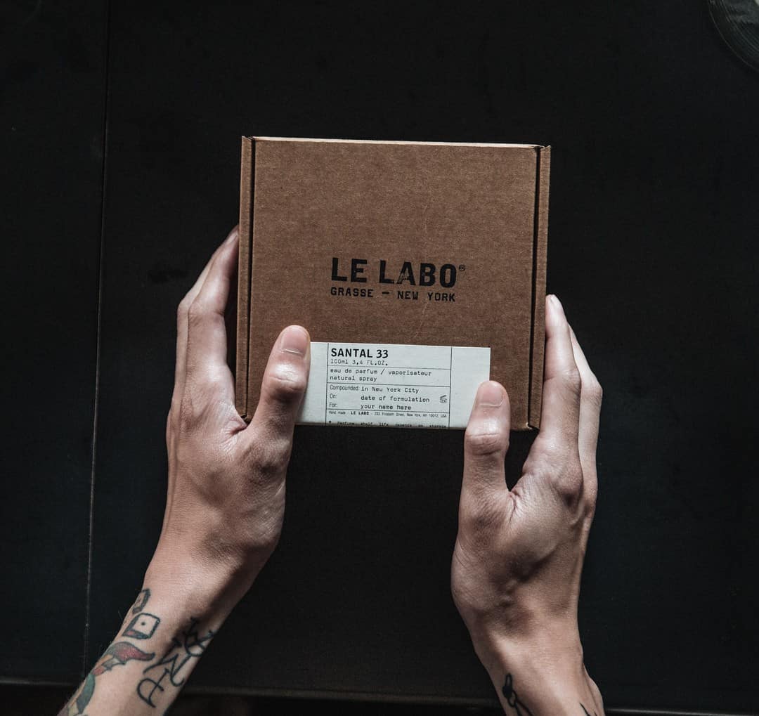 holding the box of a le labo santal 33