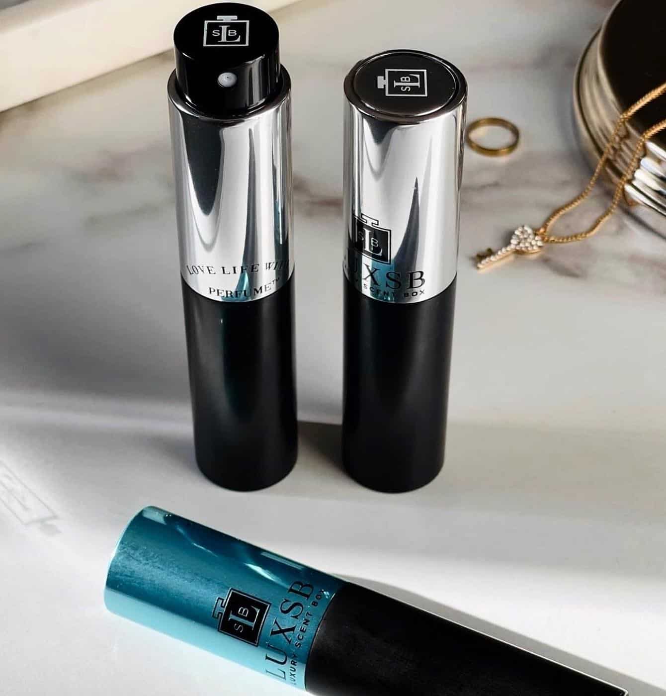 three container of LuxSB perfume atomizer