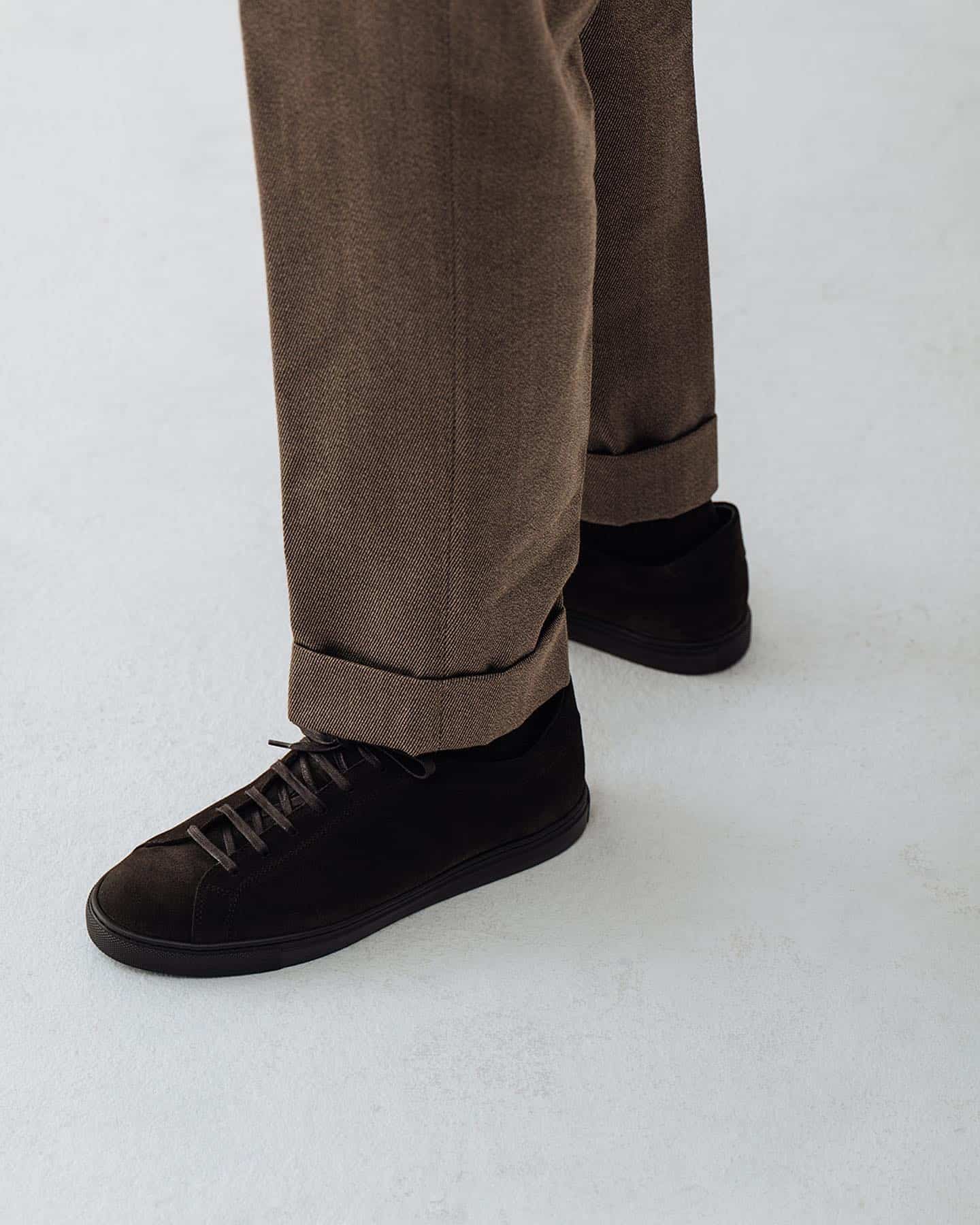 a pair of morjas brown suede sneakers