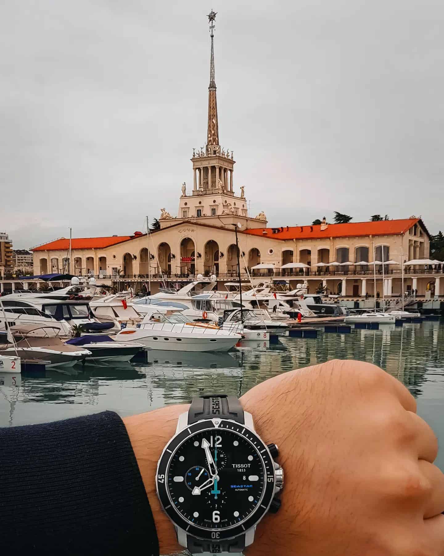 man at the docks wearing a tissot seastar