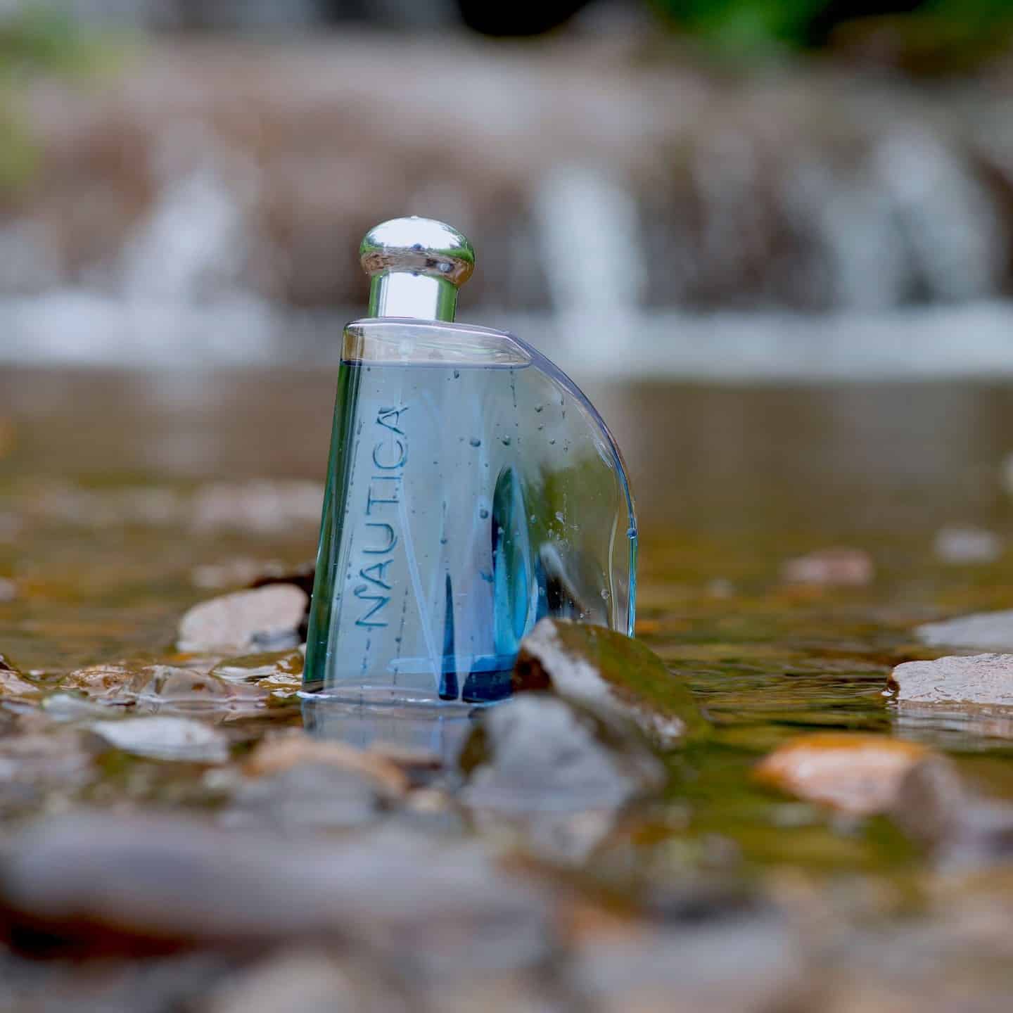 a bottle of Classic Eau de Toilette by Nautica on shallow waters