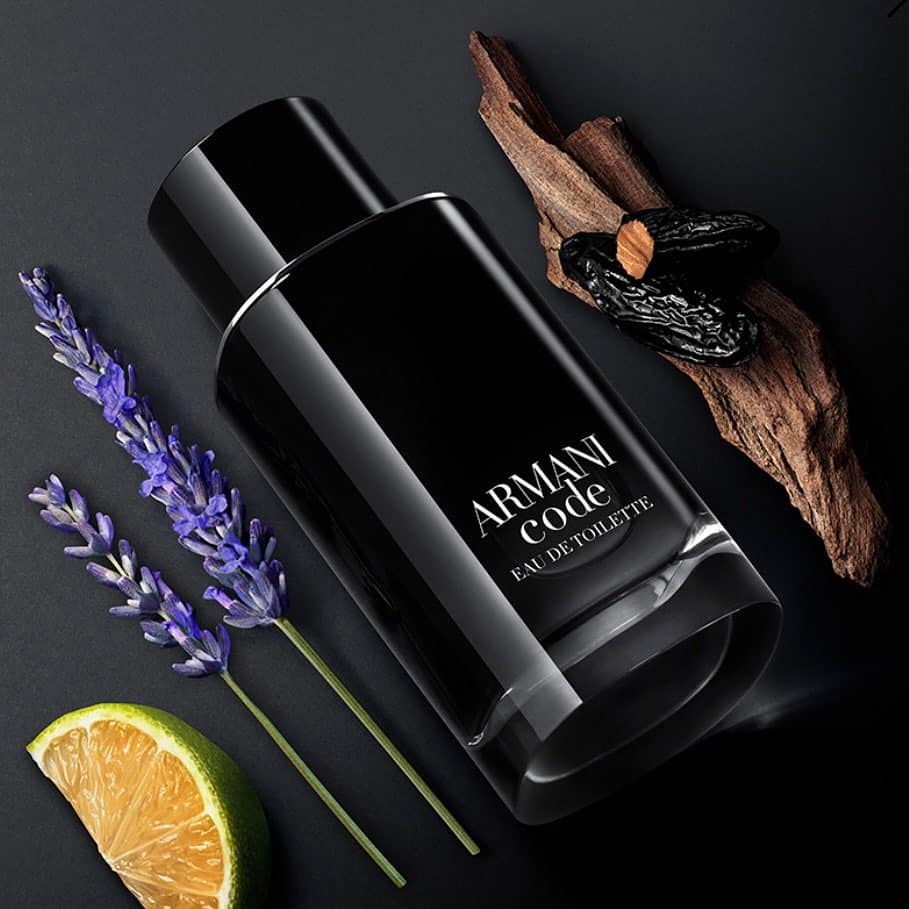 a bottle of armani code EDT and ingredients in raw form