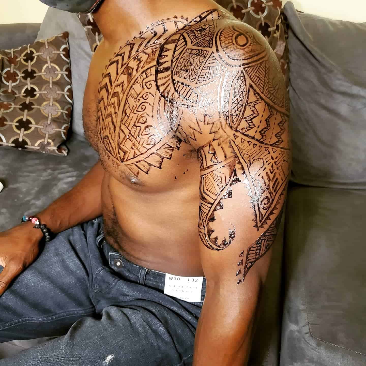 henna tattoo on left chest and arm