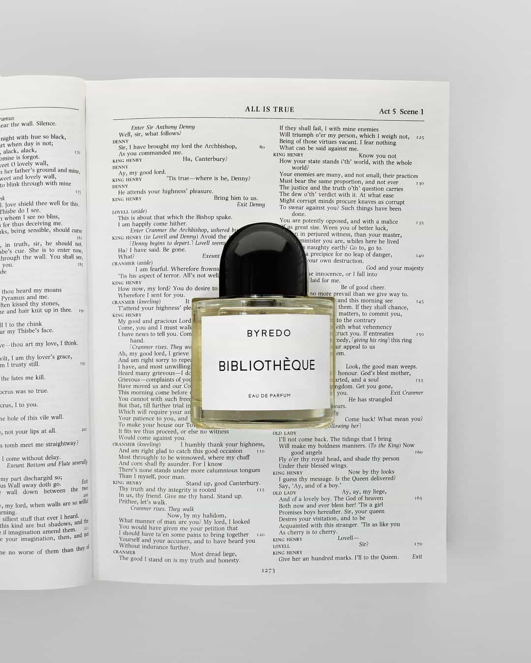 a bottle of Byredo Bibliotheque on top of an opened bible
