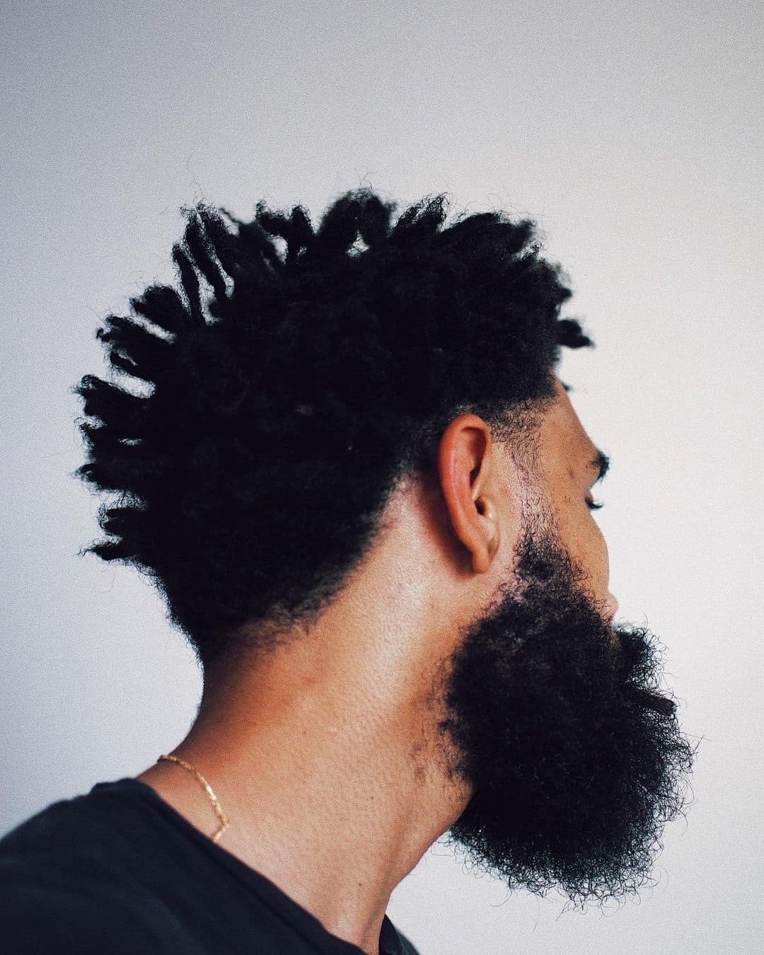 a bearded man with a curly hair
