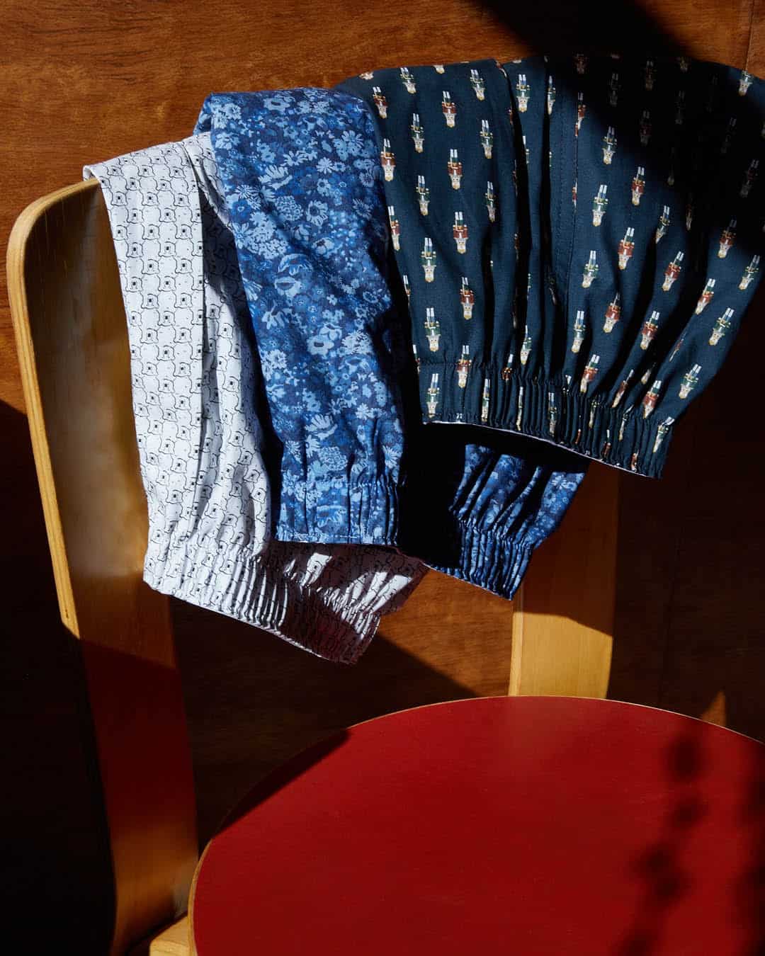 three boxer shorts hanged on the chair