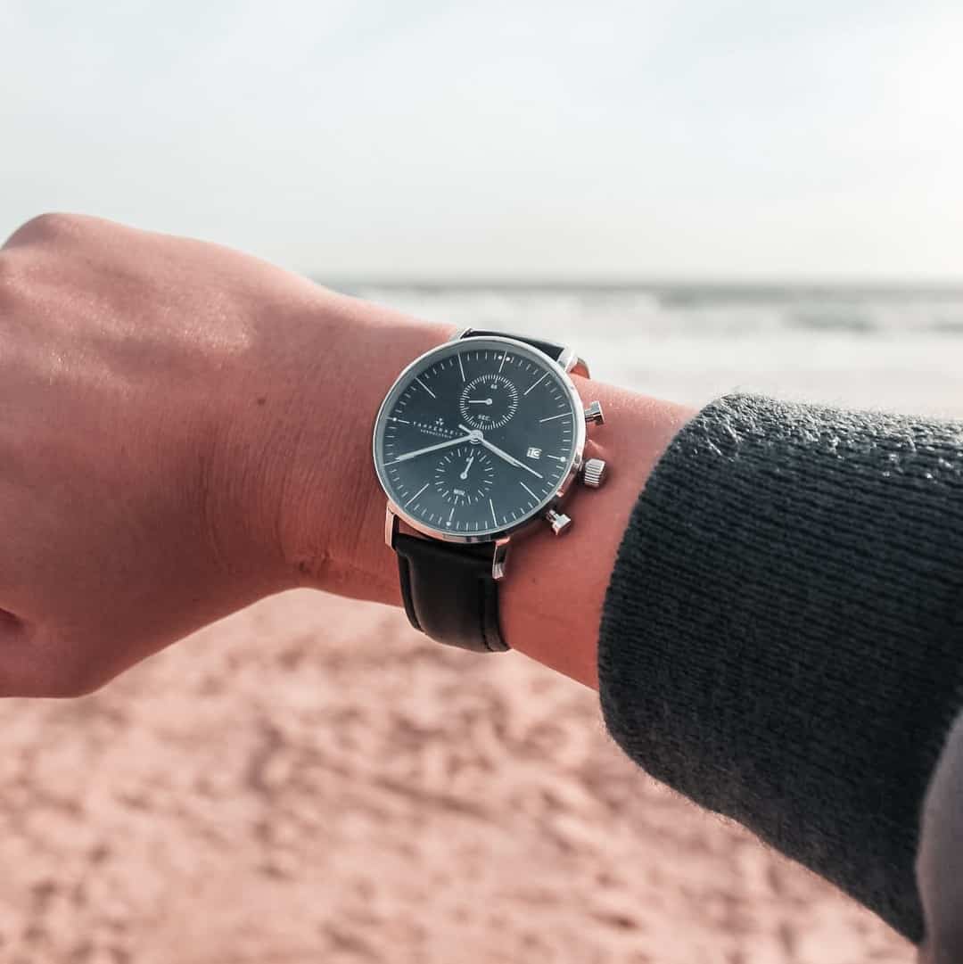 a man wearing a watch by Tapferkeit