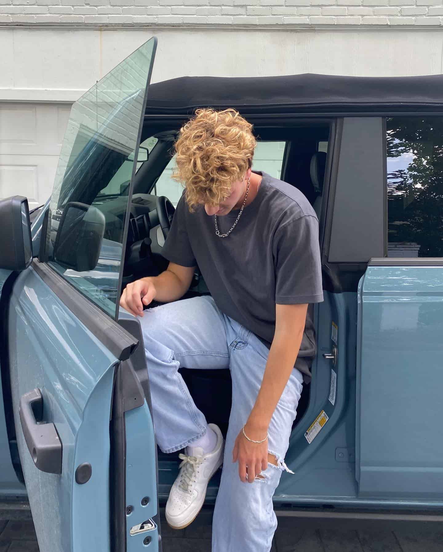 man getting out of a car