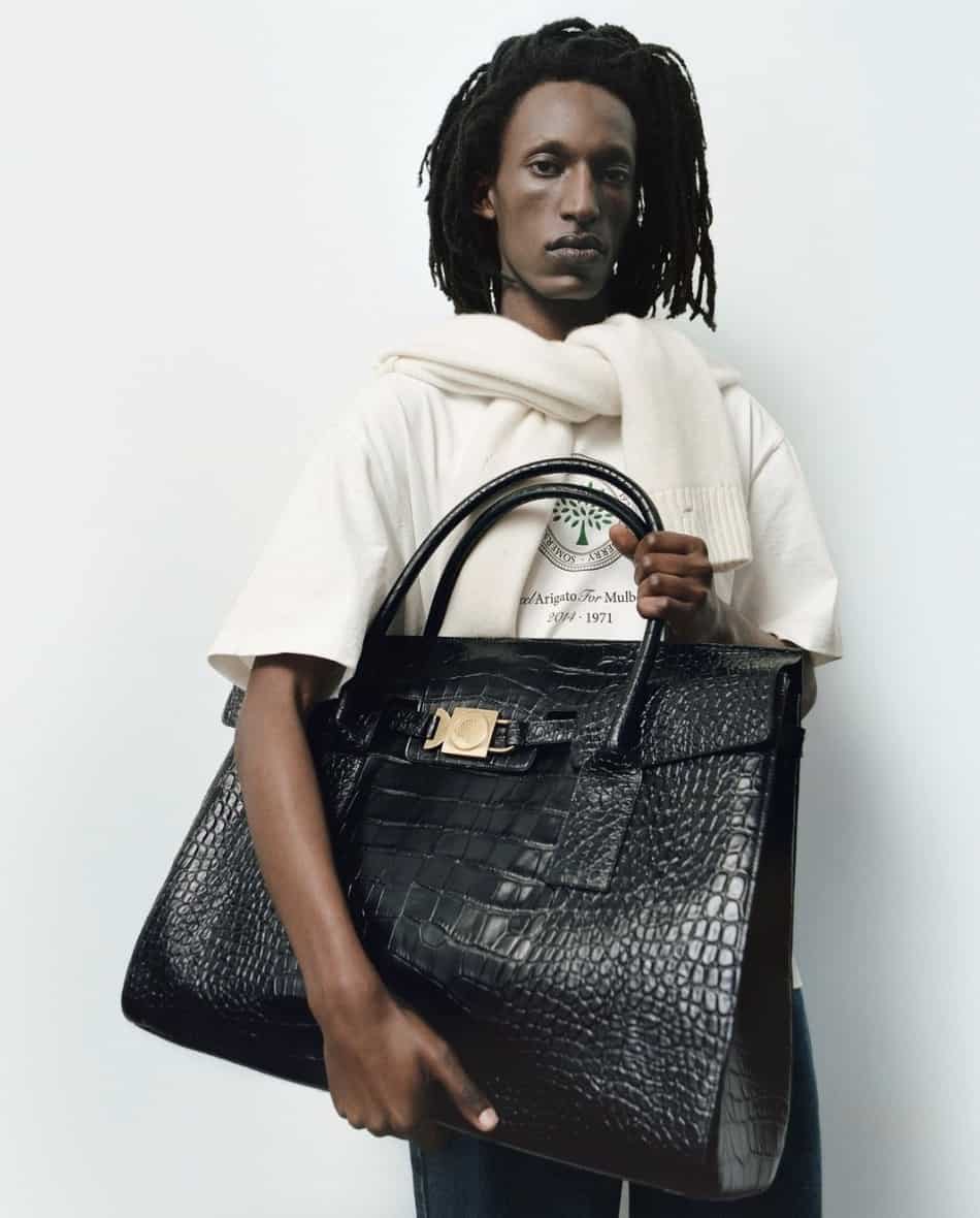 man holding a large black bag