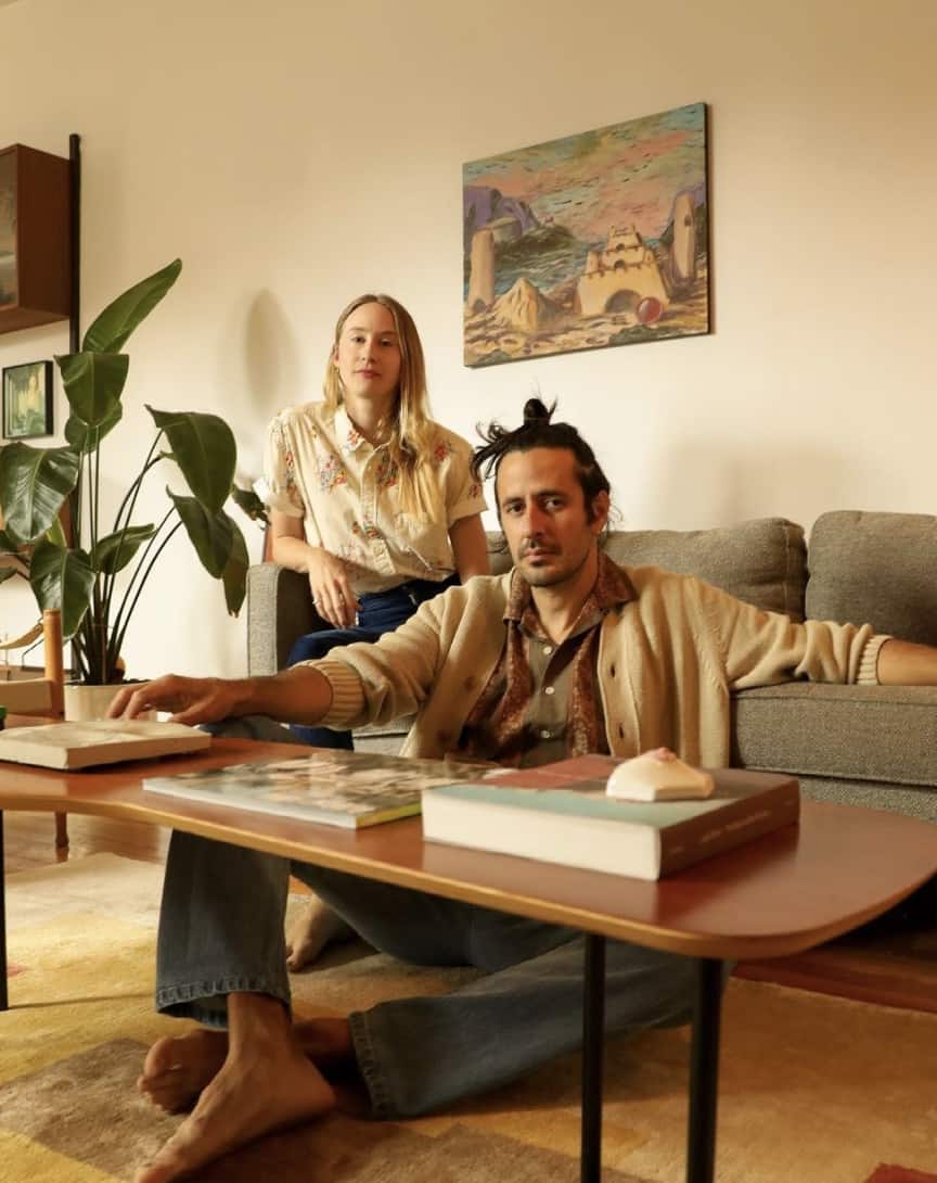 man and women sitting in a living room