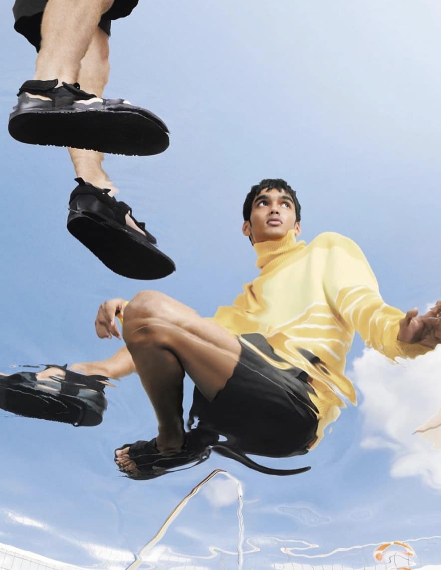 man sitting with a sky background