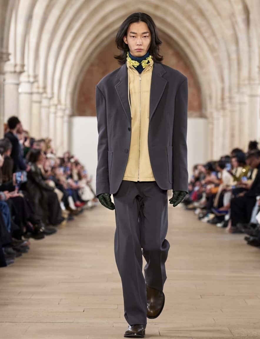man walking down a runway wearing Lanvin clothes