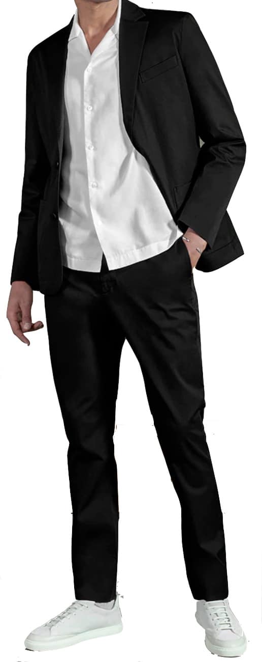 Man wearing a suit with untucked shirt