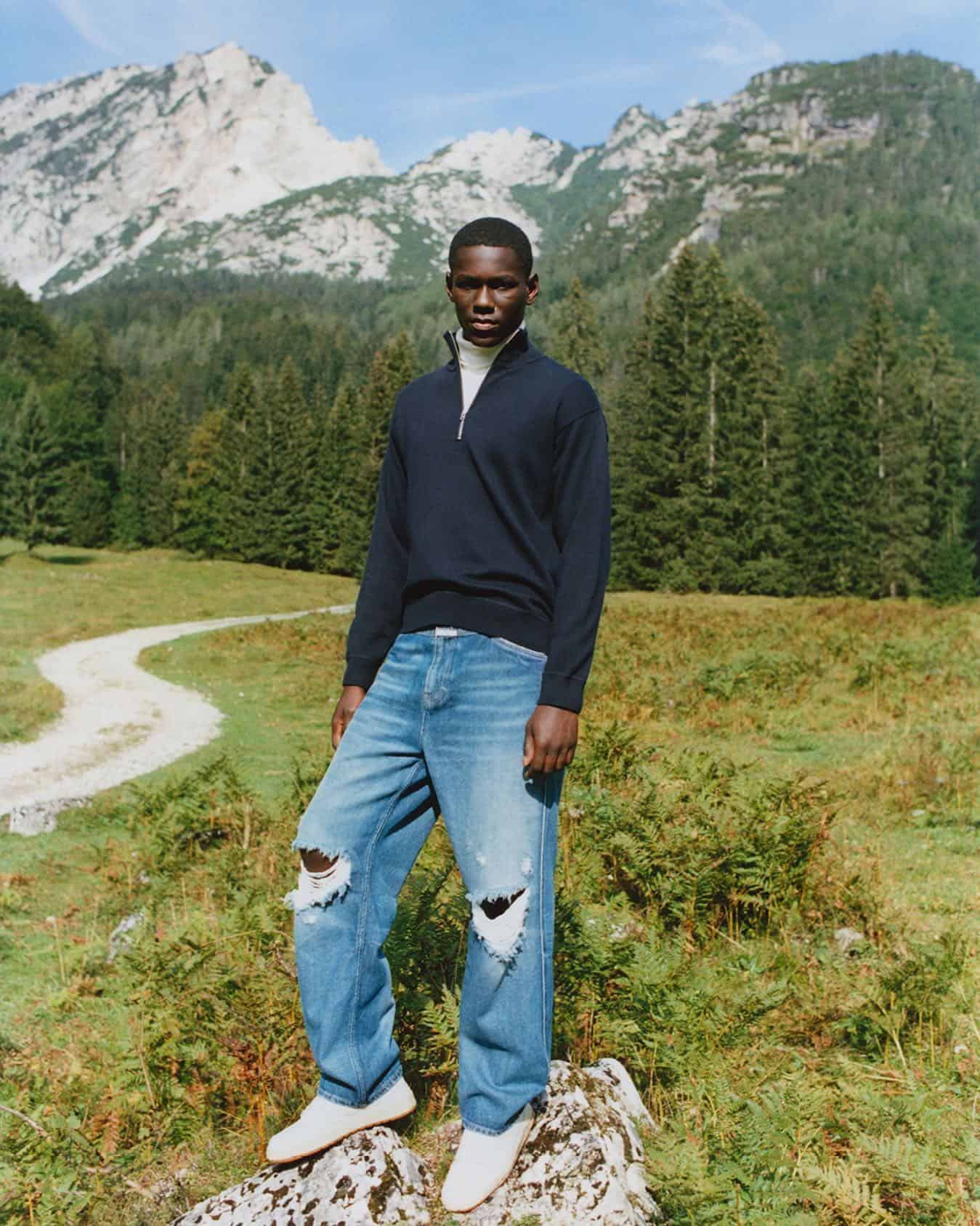 man standing on a rock
