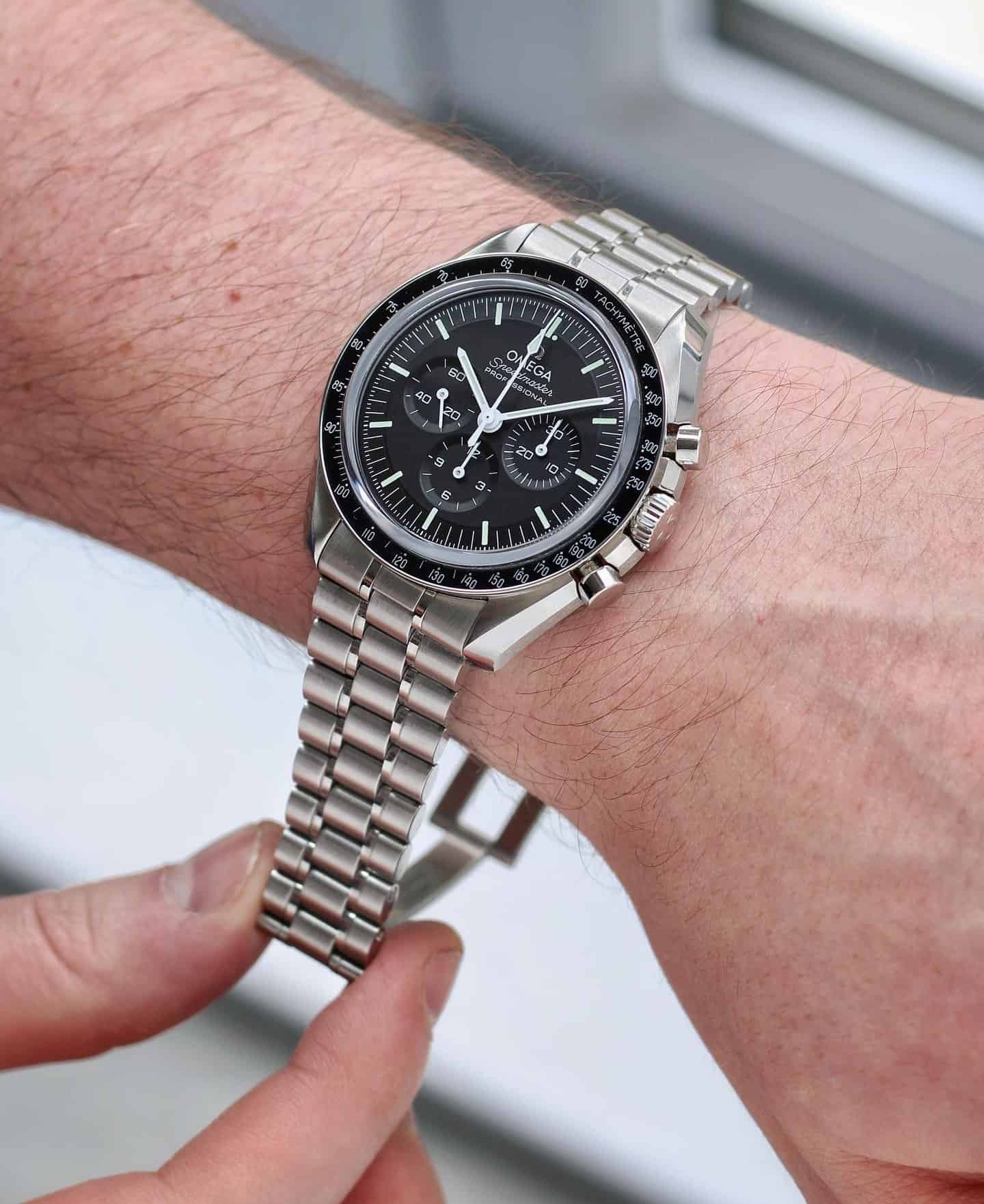 man wearing an omega speedmaster professional