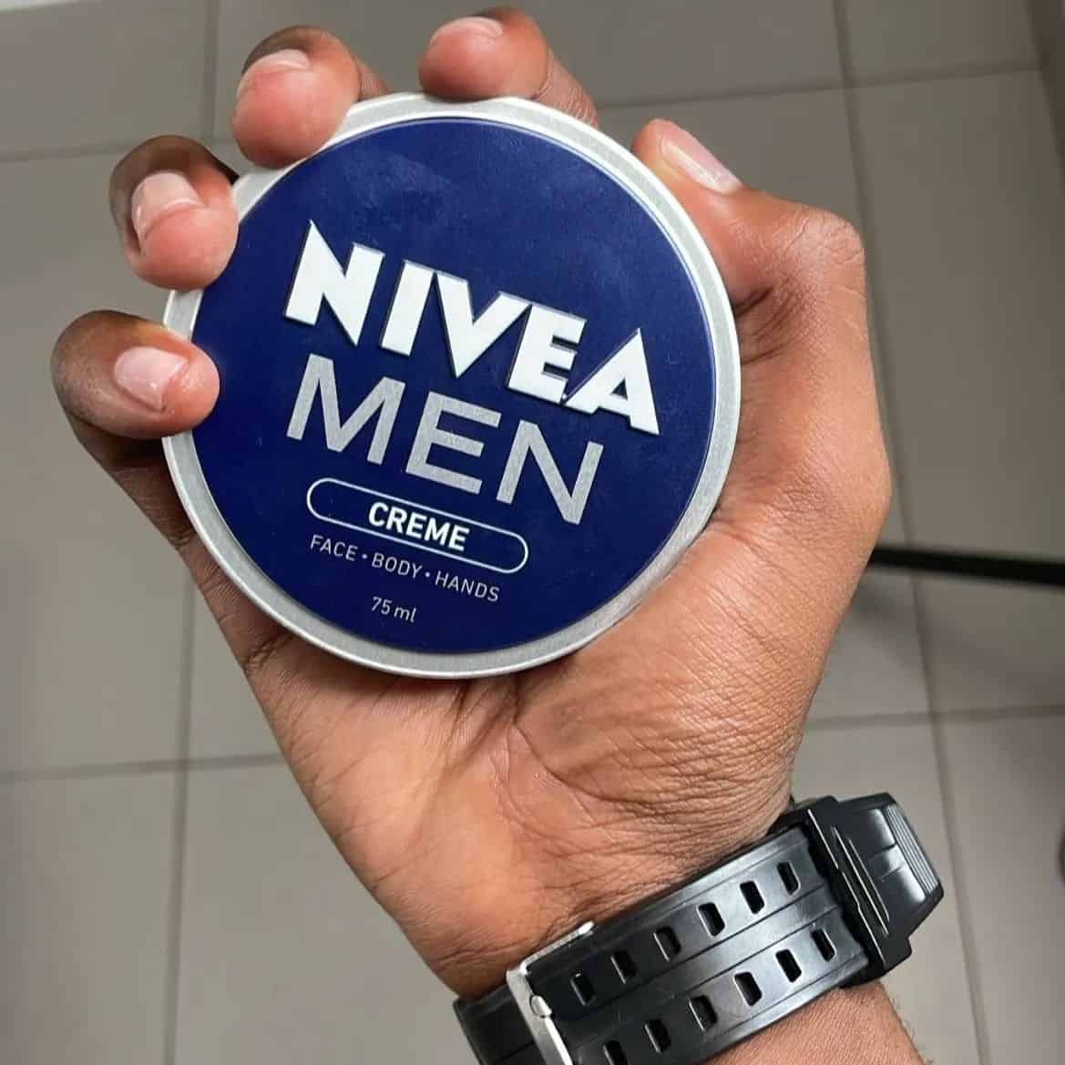 holding a can of nivea men cream