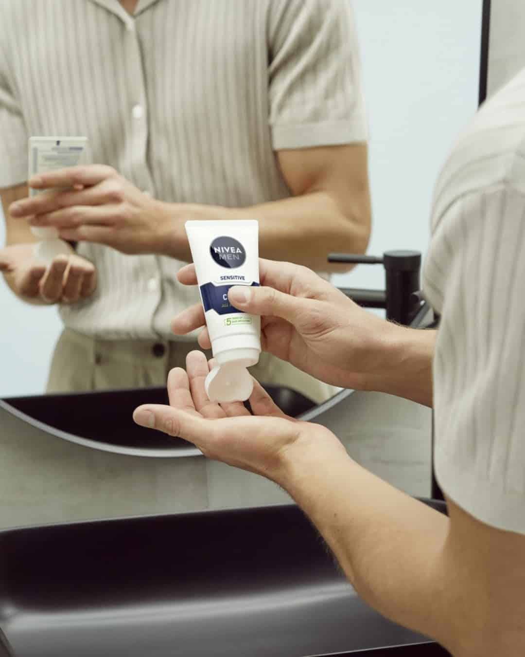 squeezing a handful of lotion