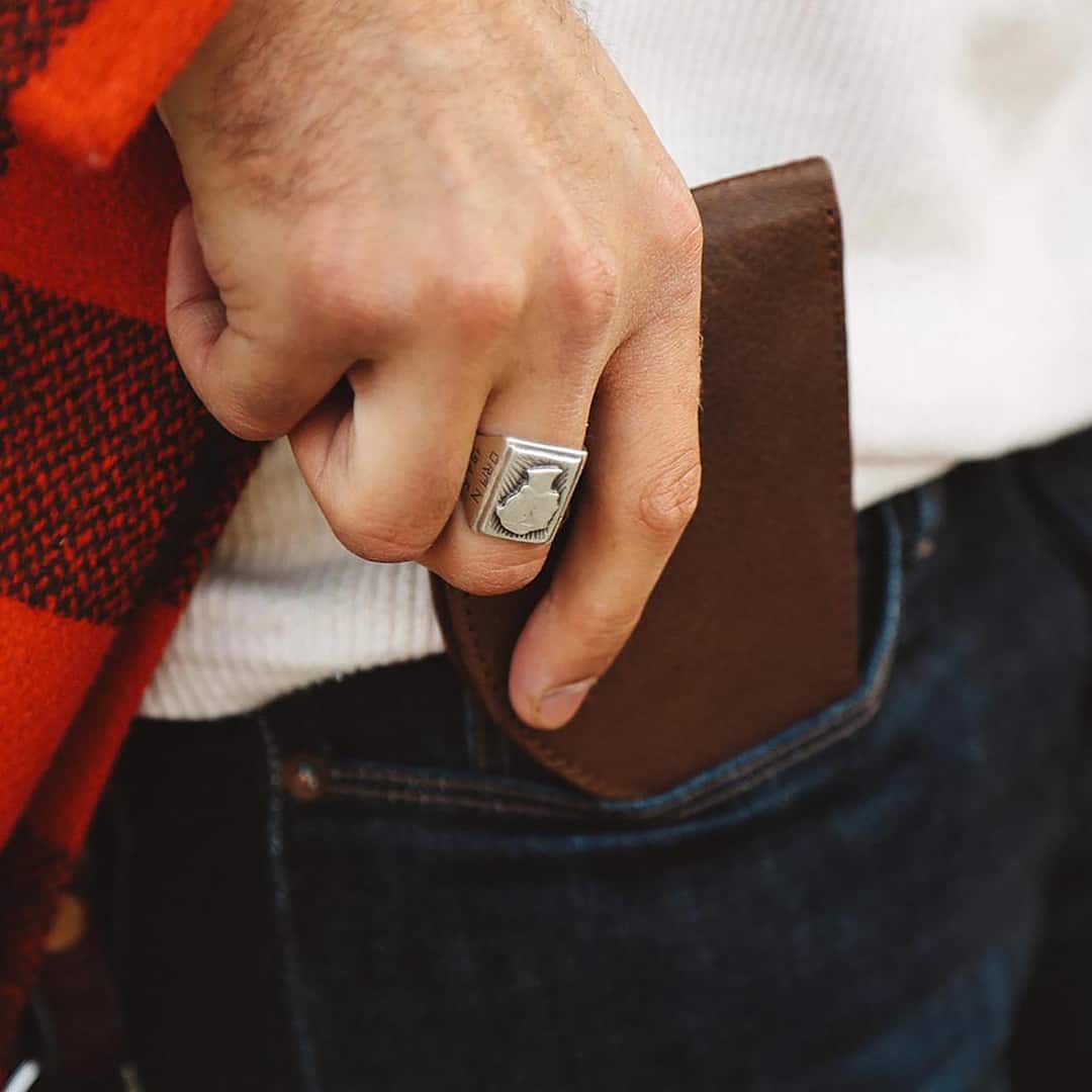 inserting a wallet into a front pocket
