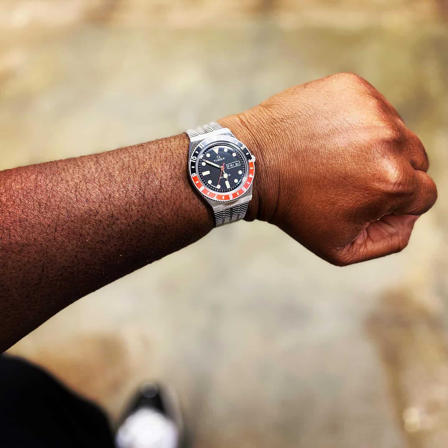 man wearing a Q timex reissue