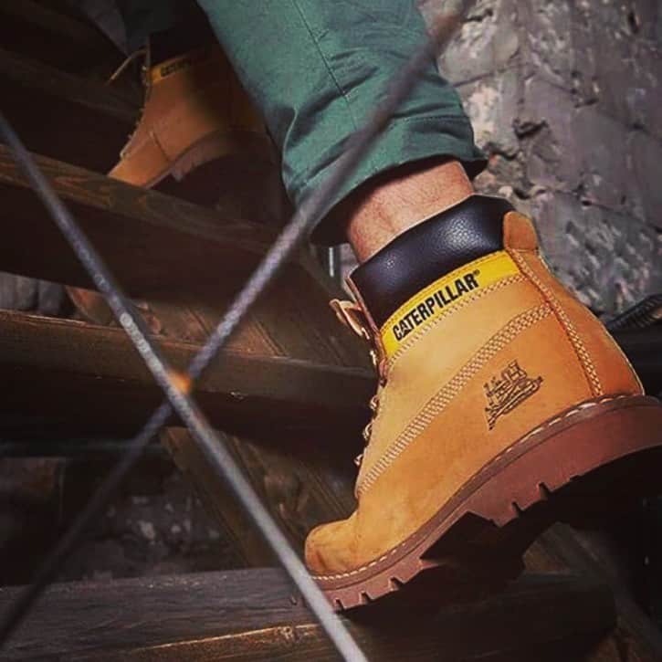 man going up a wooden stairs