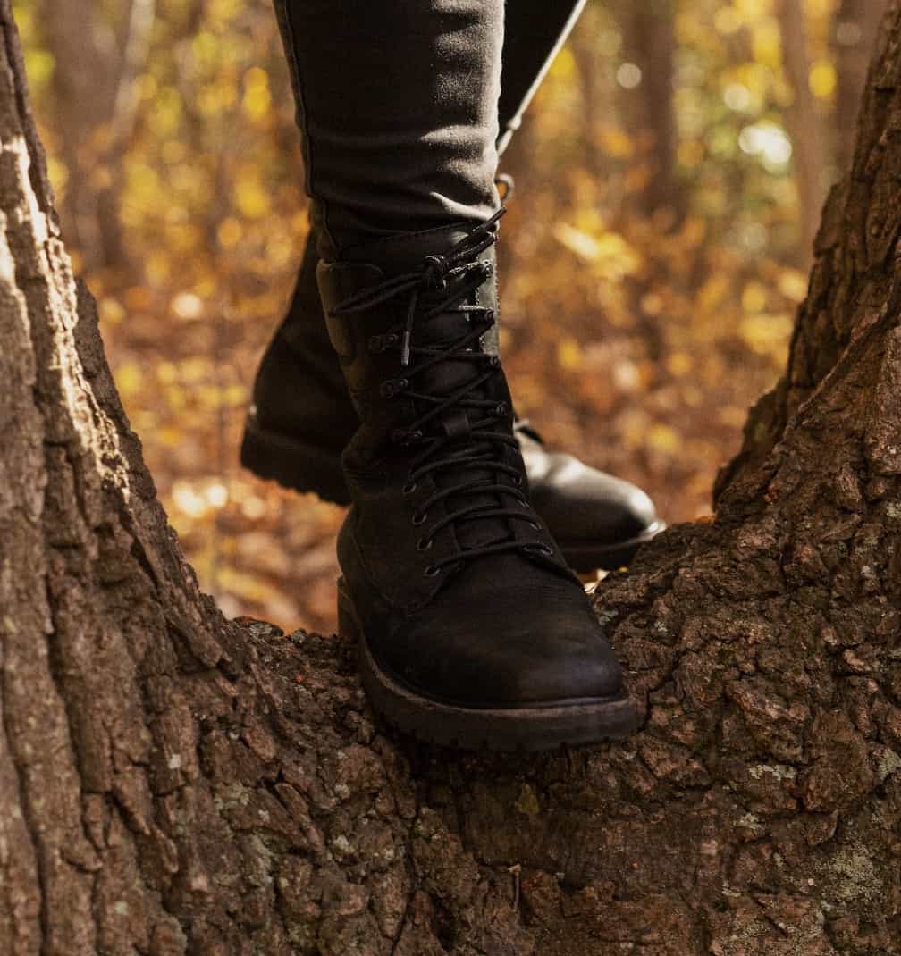 Close up of Thursday Boots Explorer boots on a tree trunk