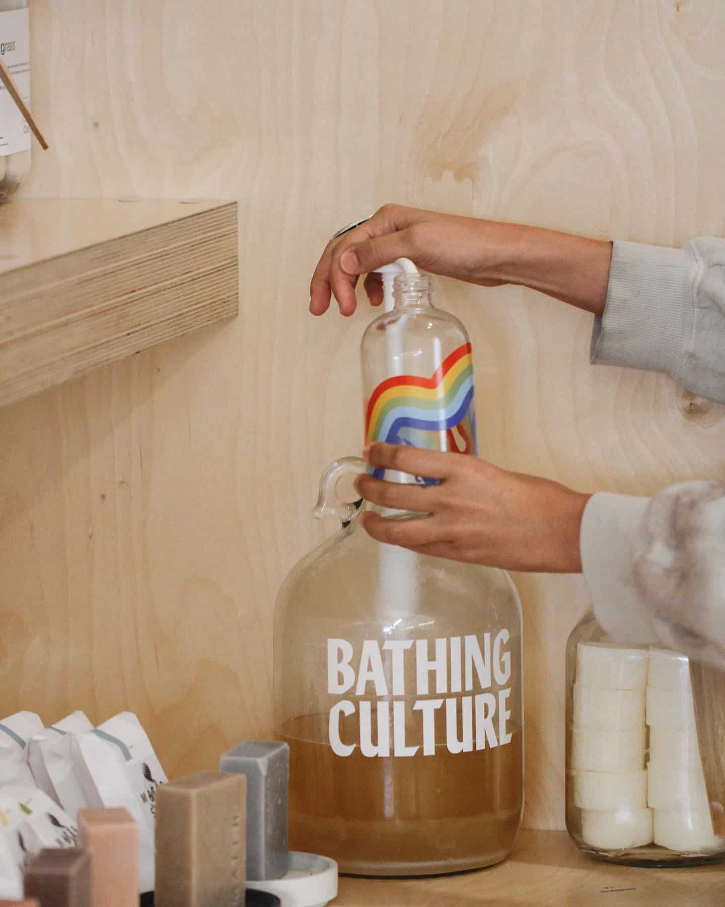 refilling an empty bottle of bathing culture body wash