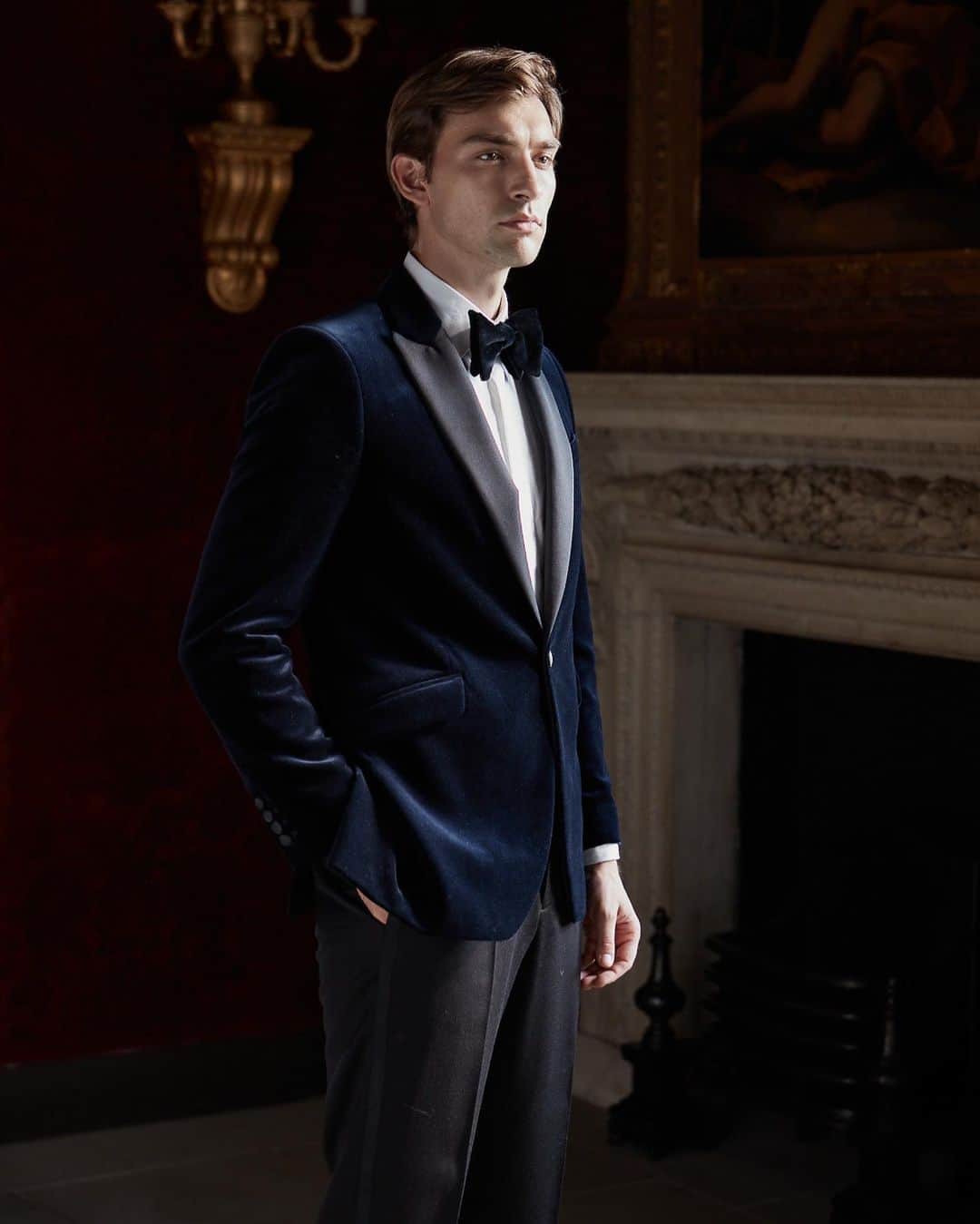 a man wearing a velvet dinner jacket
