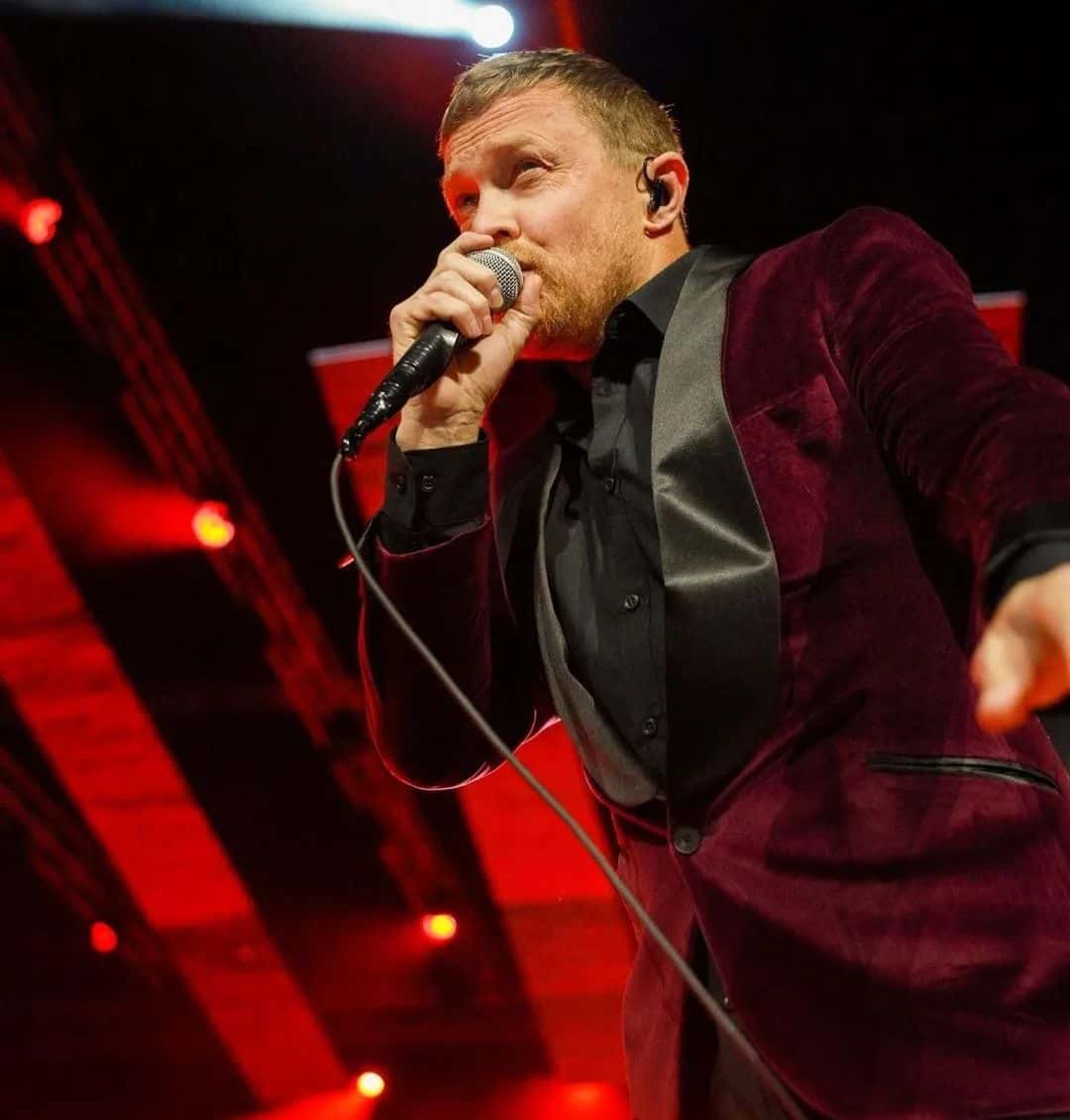 a man singing in a concert