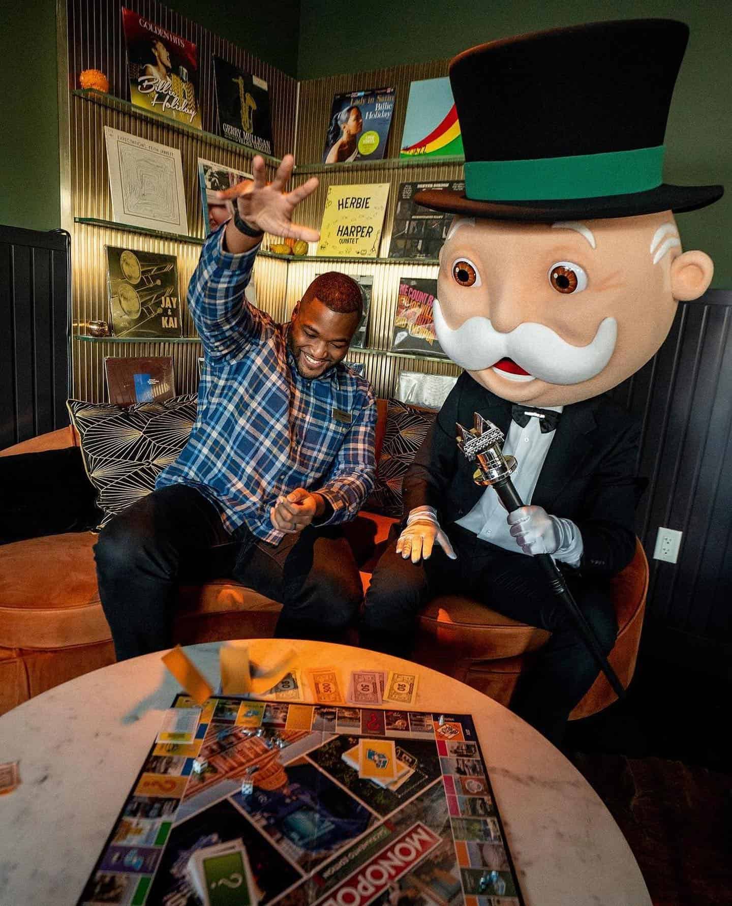 man enjoying a monopoly board game