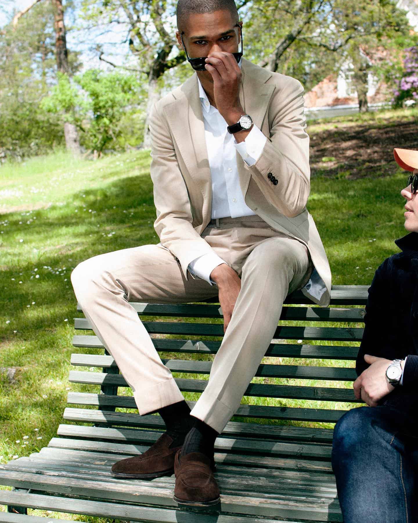 man sitting on top of a park bench