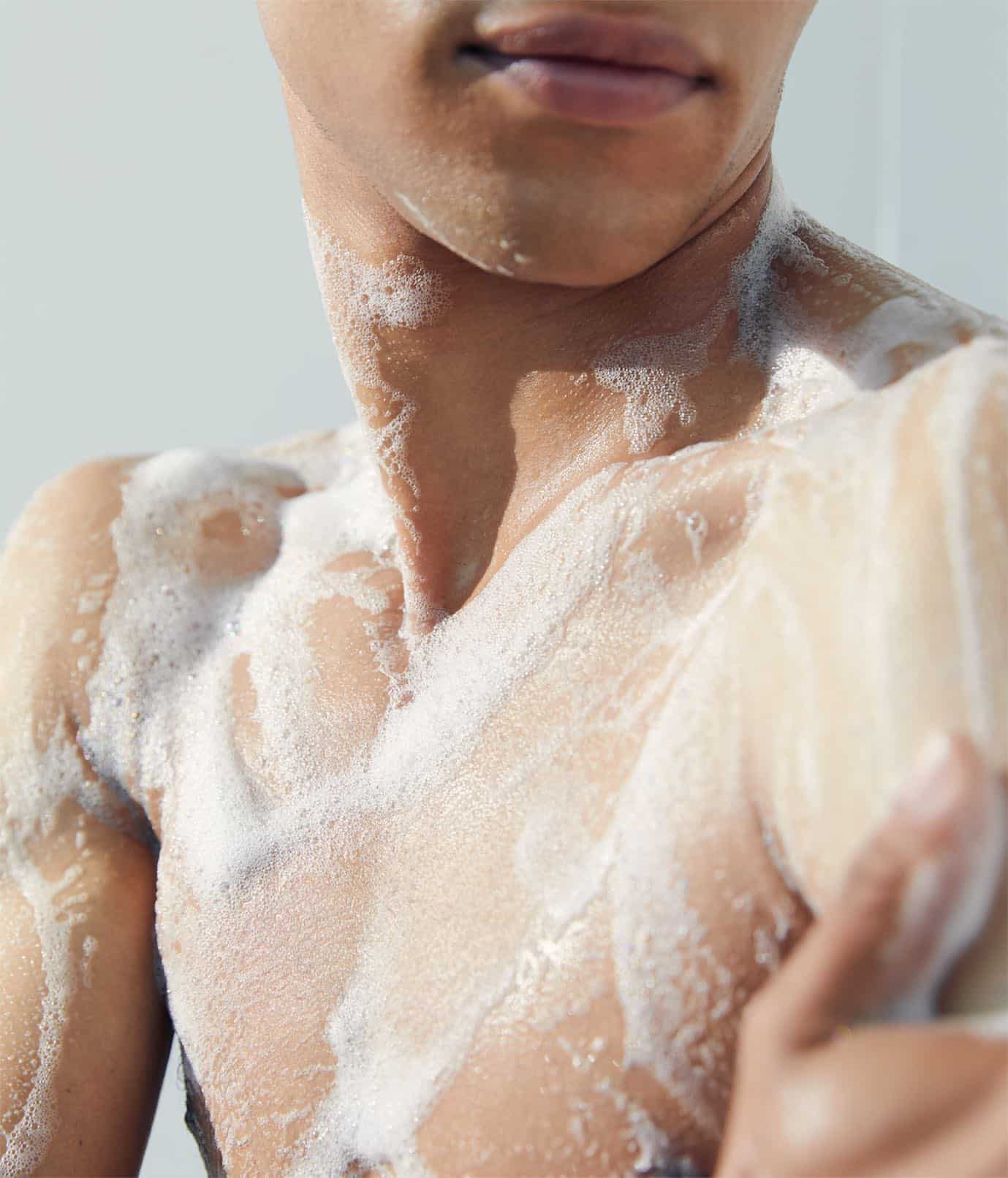 a man's body covered in foam