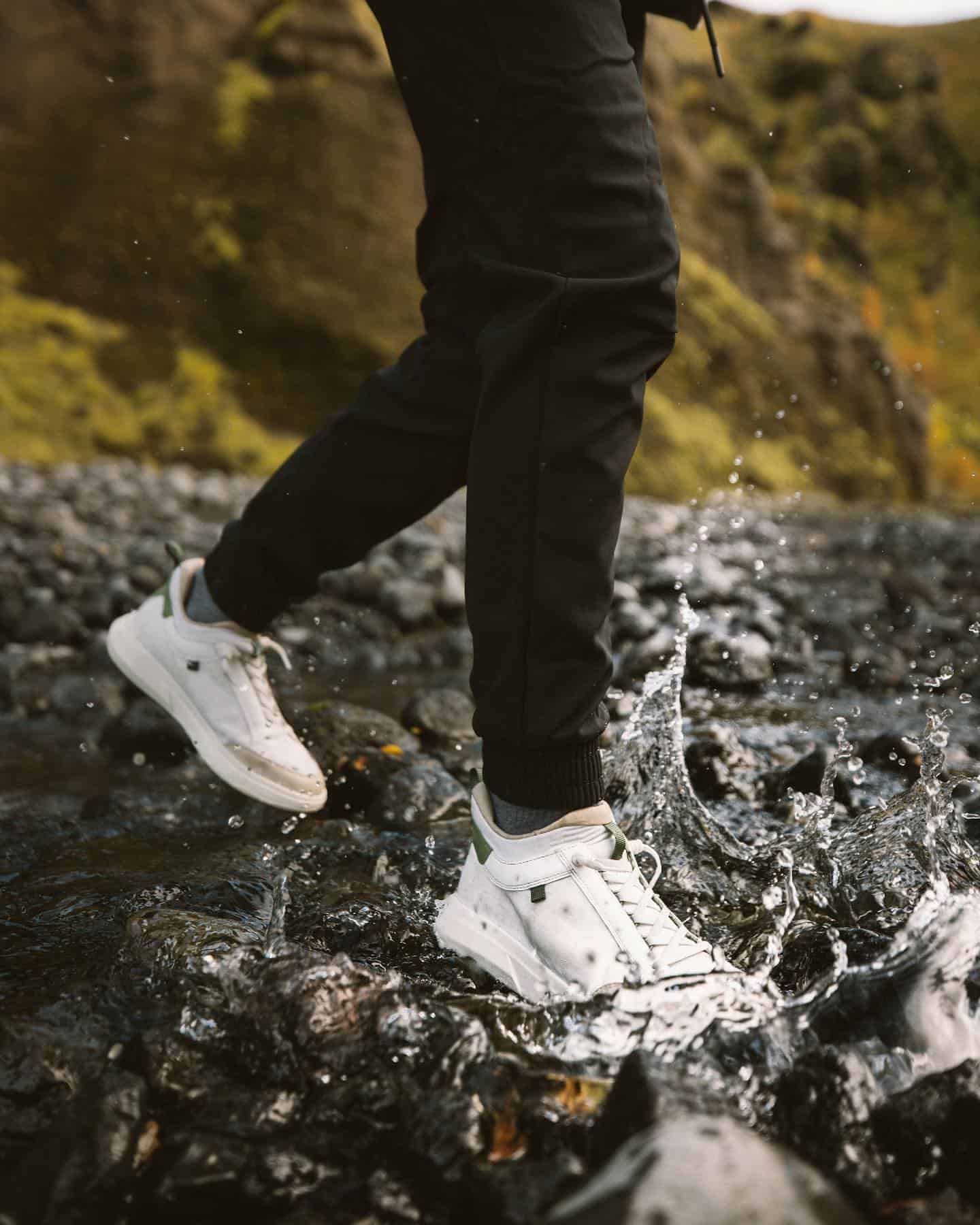 man crossing a stream