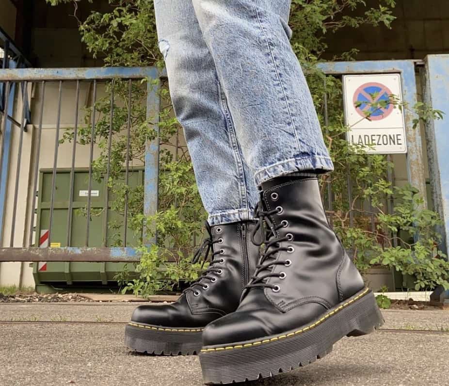 close up of a person wearing dr martens